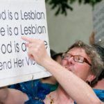A man holding a sign