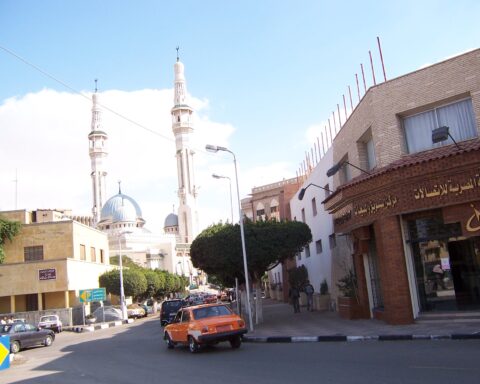 Street view in Ismailia, Egypt, with minarets in the background