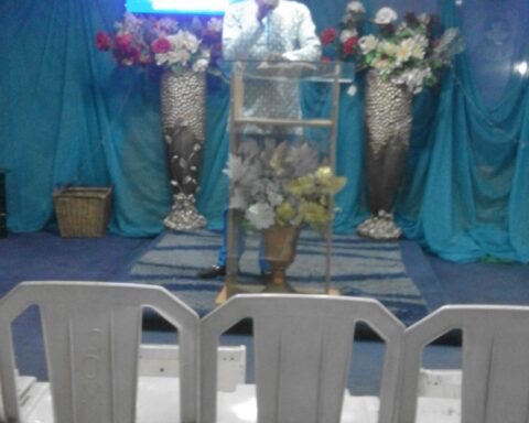 Pastor preaching in a church in Ketu, Lagos, Nigeria