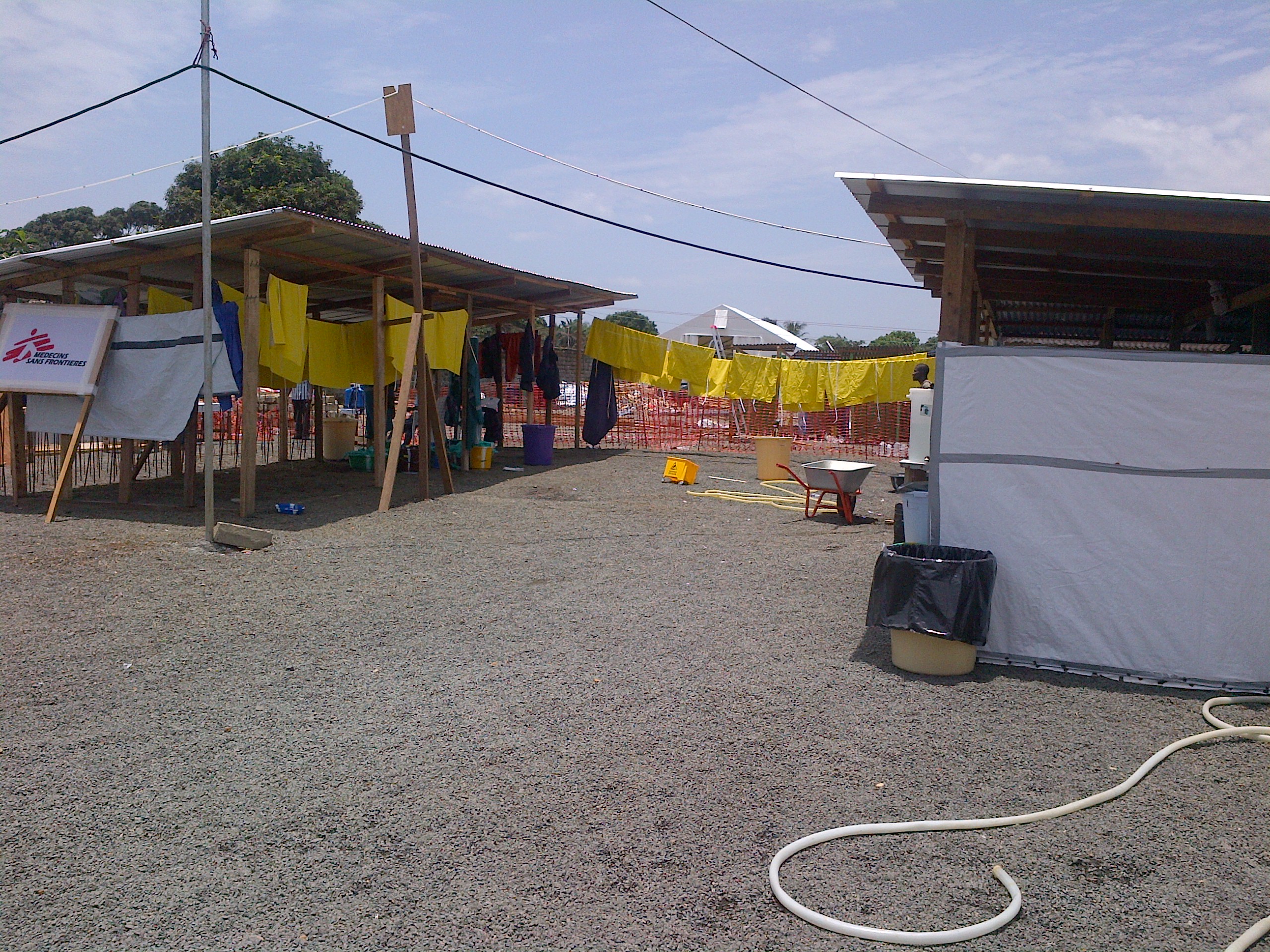 Health workers in protective equipment at an MSF Ebola treatment unit in West Africa