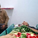 Wandaniel Girsang, injured in the face, treated at Sidikalang hospital on May 7, 2026.