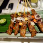 A portion of sate ayam (grilled chicken satay skewers) in Jakarta, Indonesia
