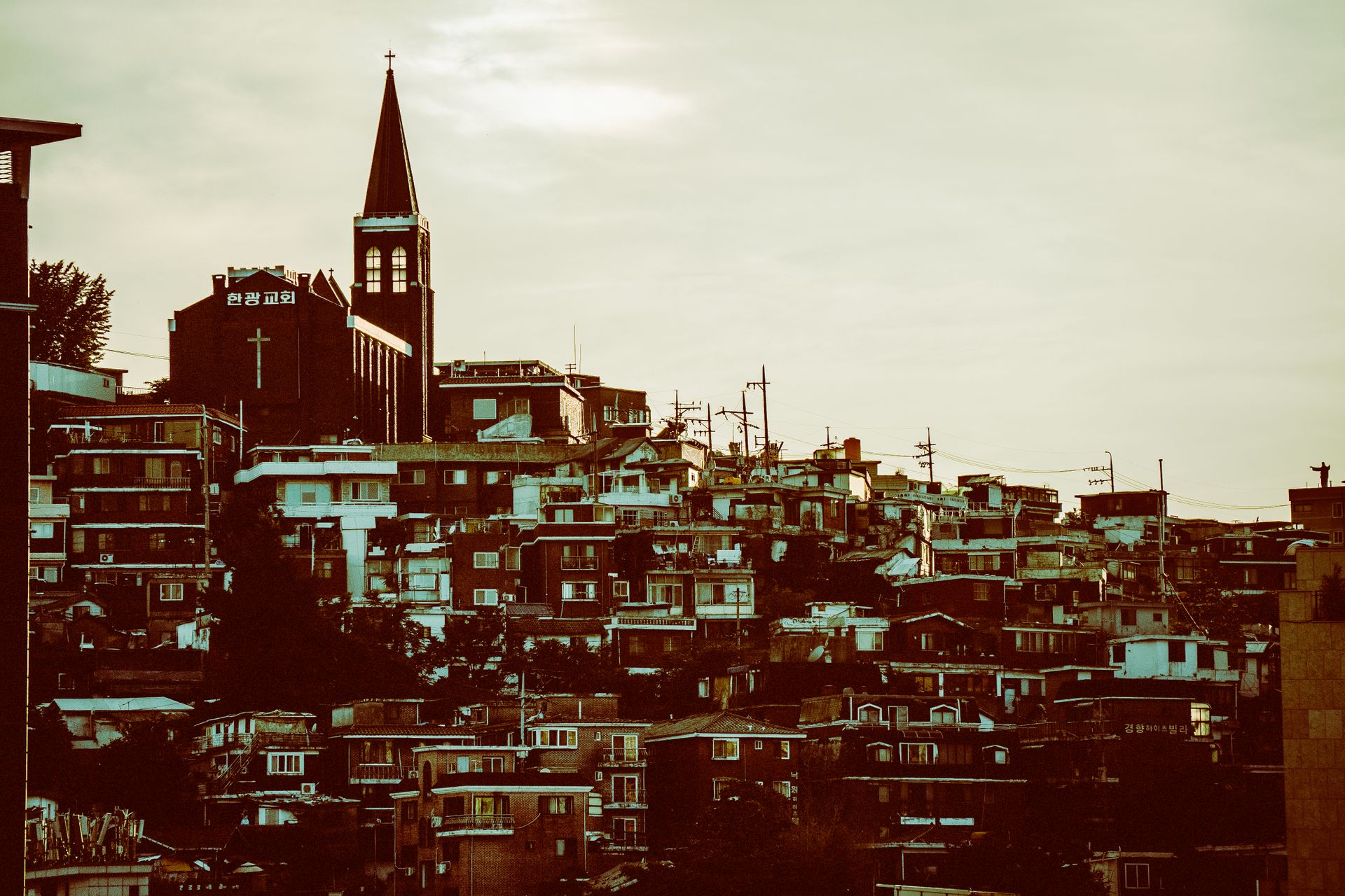 Christian cross on a residential hillside in Seoul, South Korea