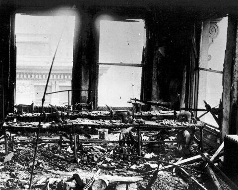 Charred sewing machines and debris cover the factory floor of the Triangle Waist Company, 9th floor, Asch Building, after the fire of March 25, 1911