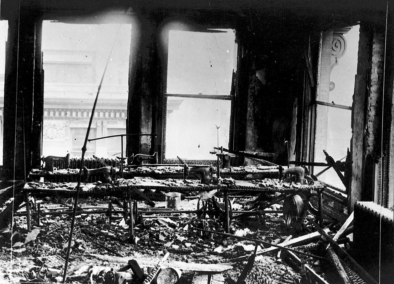 Charred sewing machines and debris cover the factory floor of the Triangle Waist Company, 9th floor, Asch Building, after the fire of March 25, 1911